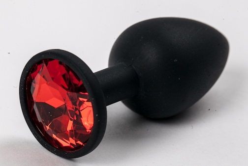 Черная силиконовая анальная пробка с красным стразом - 7,1 см. от 4sexdreaM
