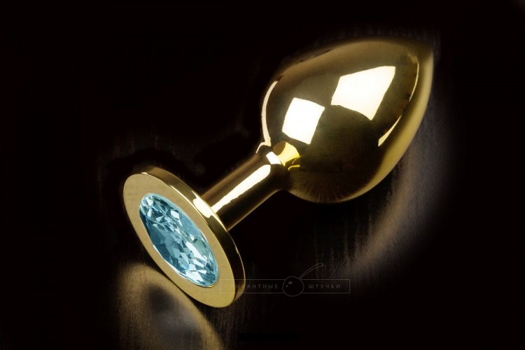 Большая золотая анальная пробка с закругленным кончиком и голубым кристаллом - 9 см.. от Пикантные штучки
